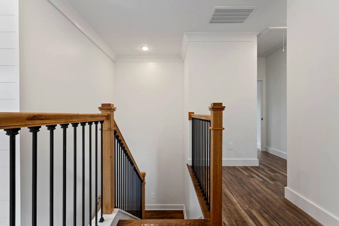 Warm oak handrail with black balusters